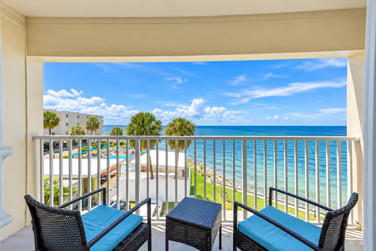 Gulf-front balcony overlooking the water at a Premier STR home in Florida
